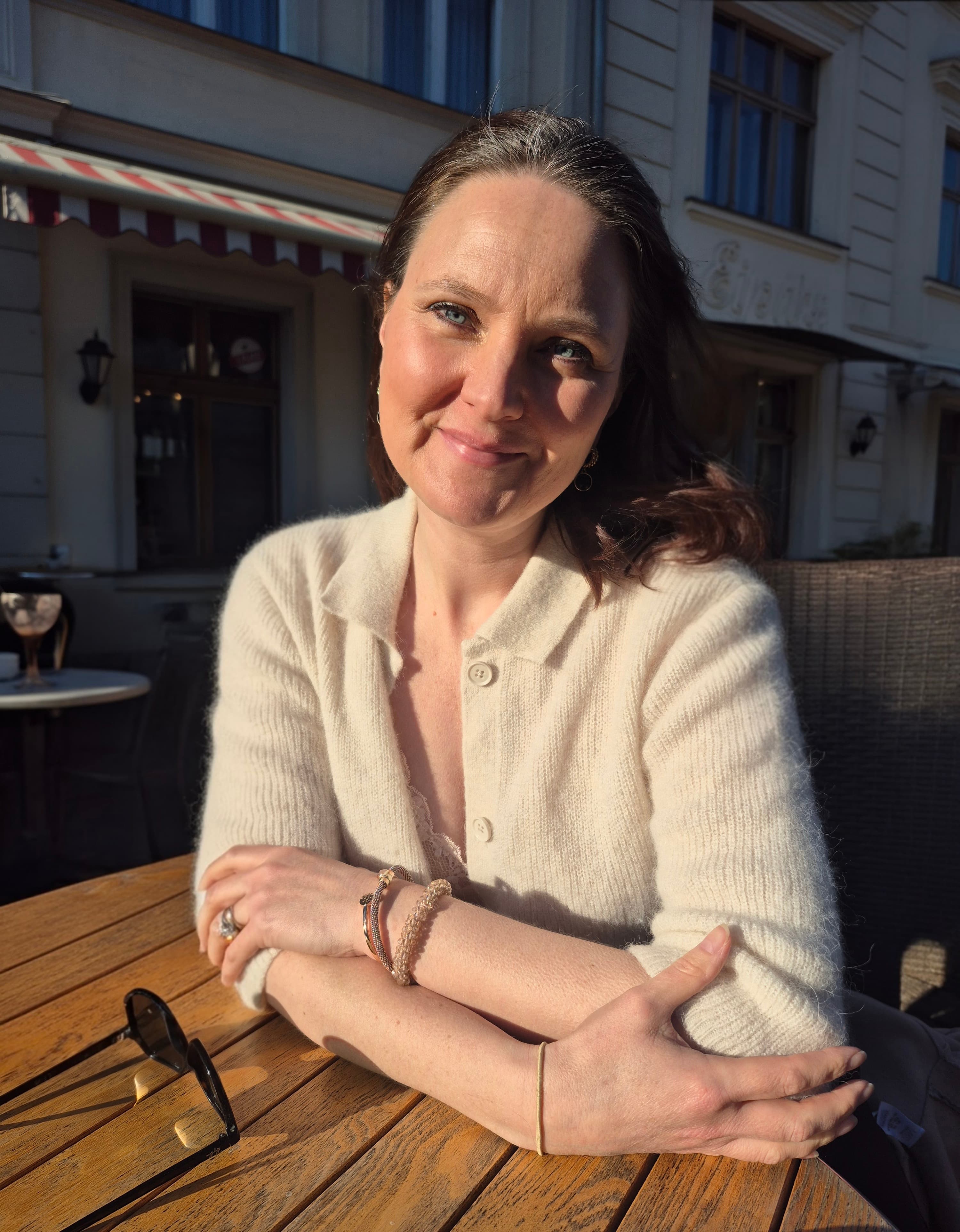Emma at a sunlit table in Potsdam