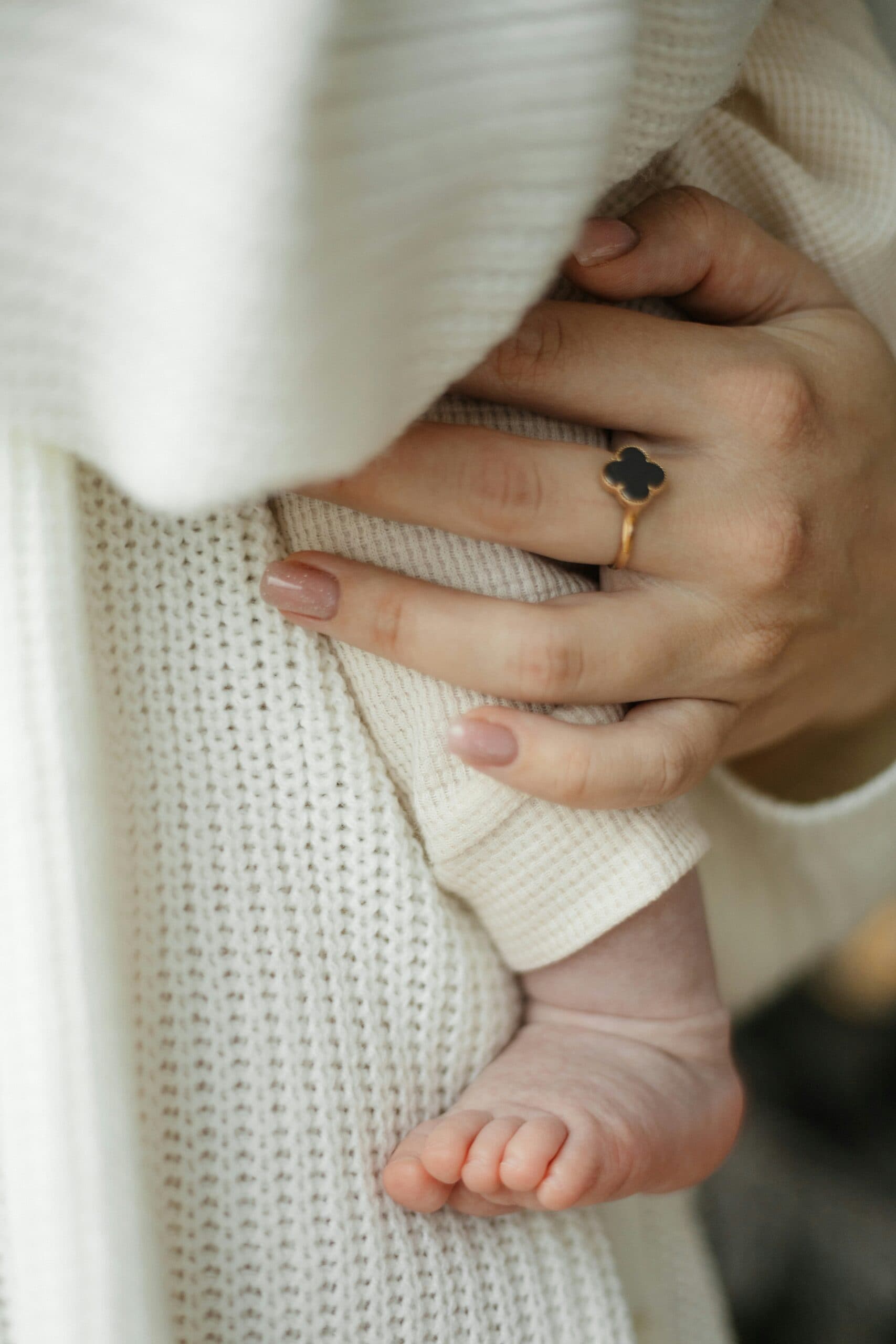 A newborn's feet, held